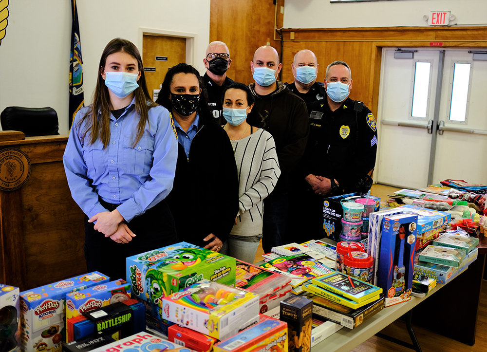 Participants in this year’s Marlborough Police Toy Drive included [l - r] dispatcher Georgie Super, Jennifer VanAmburgh, Tina Rosa and officers Curt Fulton, Mike Sotanski, Gerard Biviano and Sgt. Chris Griggs.